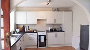 Fridge, electric kettle, toaster, cookware/dishes/utensils