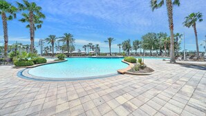 A swimming pool with palm trees and lounge chairs. - FREE Daily Golf! Reflections 211 Bayfront Beauty, Heated Resort Pool, Hot Tub (Panama City)
