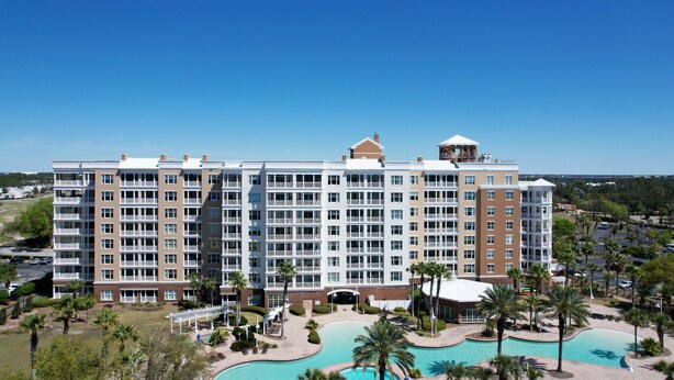 A multi-story hotel with a swimming pool and palm trees. - FREE Daily Golf! Reflections 211 Bayfront Beauty, Heated Resort Pool, Hot Tub (Panama City)