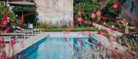Seasonal outdoor pool, pool umbrellas, pool loungers