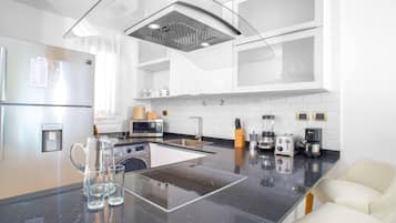 Apartment | Private kitchen | Full-size fridge, microwave, coffee/tea maker, toaster