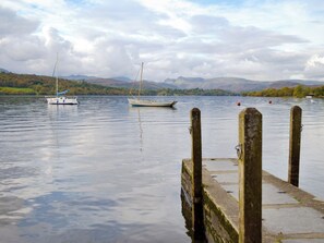 A calm lake with a dock and two sailboats. - 2 bedroom accommodation in Levens, near Kendal (Levens, near Kendal)