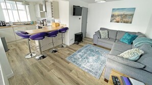 A modern apartment with a kitchen, dining area, and living room. - 2 bedroom accommodation in Levens, near Kendal (Levens, near Kendal)