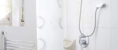 Bathtub, bidet, towels, soap