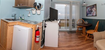 Comfort Cabin | Living area | 55-inch flat-screen TV with cable channels, TV