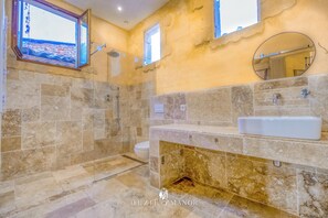 Combined shower/tub, hair dryer, towels, soap