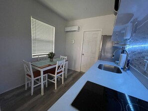 Fridge, microwave, stovetop, coffee/tea maker
