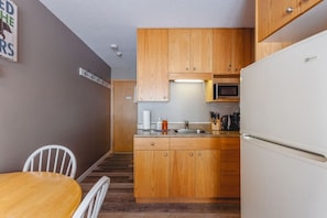 Fridge, coffee/tea maker, toaster, cookware/dishes/utensils