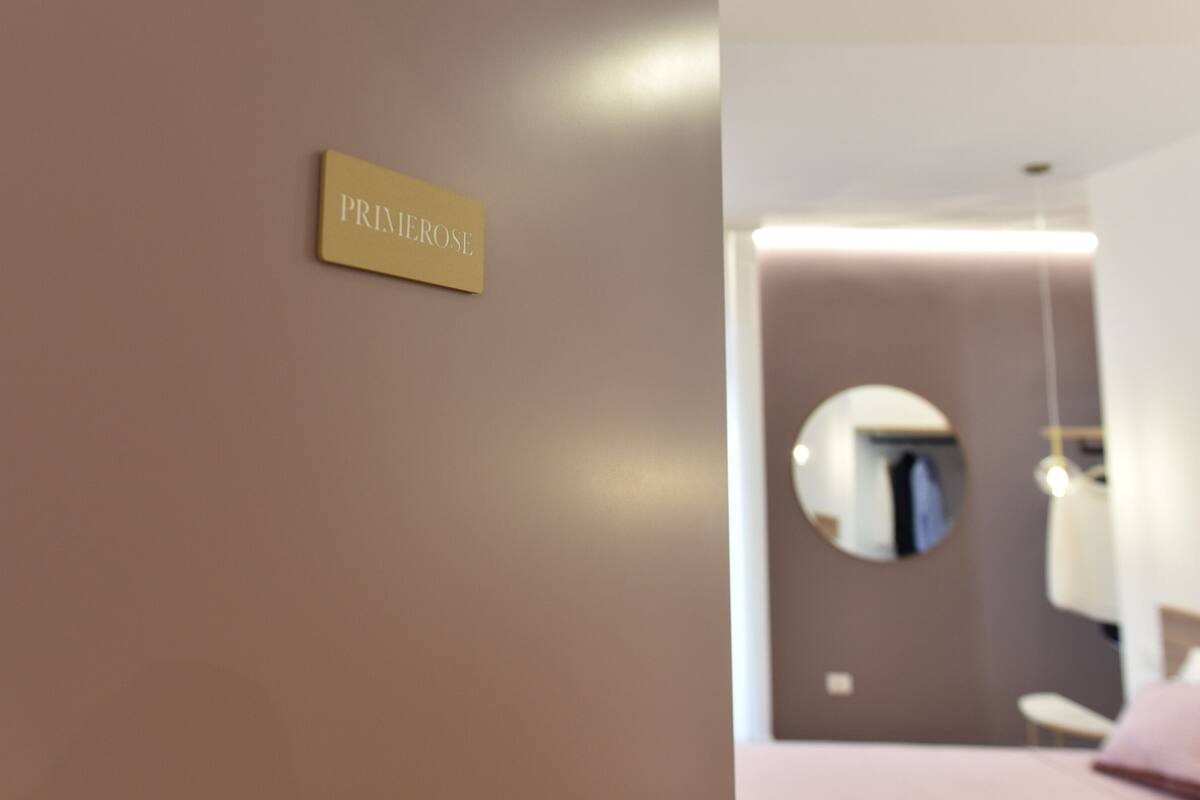A sign labeled "PRIMEROSE" on a wall.