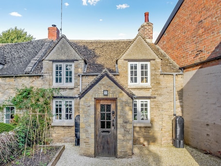 Exterior. A charming and characterful Cotswold cottage in the heart of a quaint village.