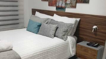 2 dormitorios, tabla de planchar con plancha, wifi gratis y ropa de cama