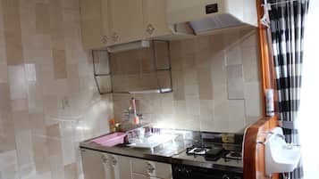 Fridge, microwave, stovetop, cookware/dishes/utensils