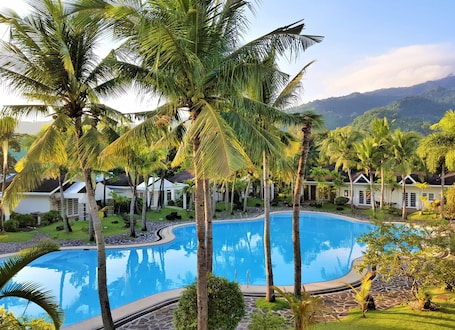 Indoor pool, outdoor pool, open 7:00 AM to 9:00 PM, pool loungers. Chateau Bleu Resort