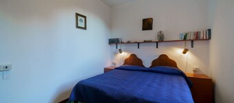 Rustic Villetta Le Grotte sleeps 8 comfortably with a view of the bay of Portoferraio