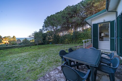 Rustic Villetta Le Grotte sleeps 8 comfortably with a view of the bay of Portoferraio