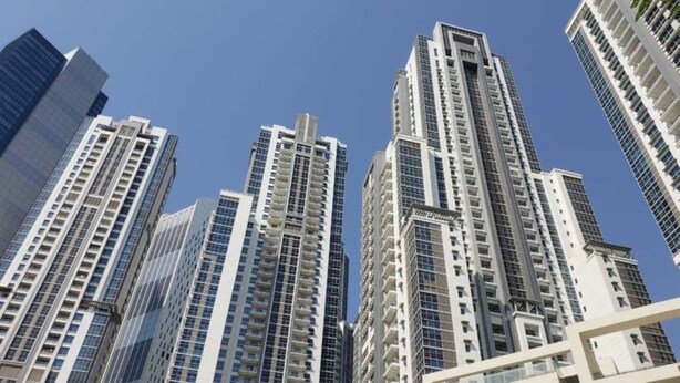 A cluster of high-rise buildings with multiple floors and balconies. - Executive Towers Amazing 1BR Onsite Pool Business bay (Dubai)