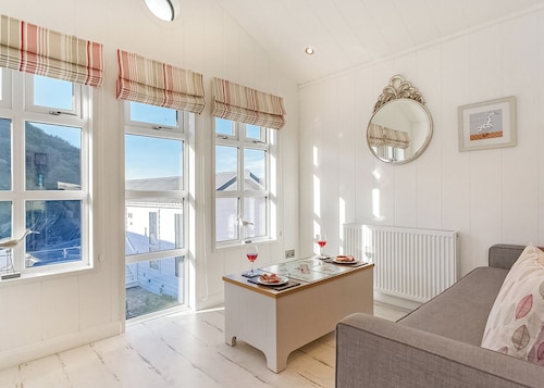 This chic country style beach hut is ideal for a romantic escape by the sea.