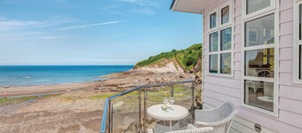 This chic country style beach hut is ideal for a romantic escape by the sea.