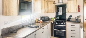 Modern and contemporary 12ft wide caravan with one double and one twin.