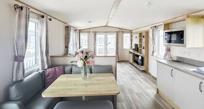 Modern and contemporary 12ft wide caravan with one double and one twin.