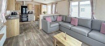 Modern and contemporary 12ft wide caravan with one double and one twin.