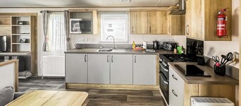 Modern and contemporary 12ft wide caravan with one double and one twin.