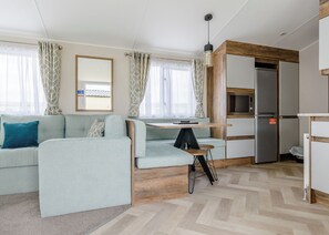 Living area - 12ft-wide luxury caravan with one double and one twin. (Roman Bank, Skegness)