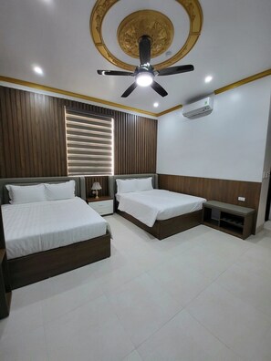 Deluxe Twin Room, 2 Queen Beds | Minibar, desk, free WiFi, bed sheets - Nam Hong Hotel (Binh Xuyen)