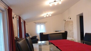 A modern dining area with a glass table, black chairs, and a red table runner. - Villa Andi Sea view, Terrace, Wi-fi, Dishwasher, Washing machine, Parking (Peroj, Vodnjan)