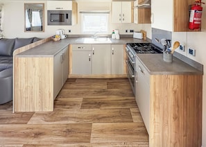 Oven - Modern and contemporary 12ft-wide caravan with one double and one twin. (Bleadon, Weston-Super-Mare)