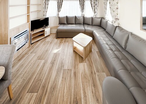 Modern and contemporary 12ft-wide caravan with one double and one twin.