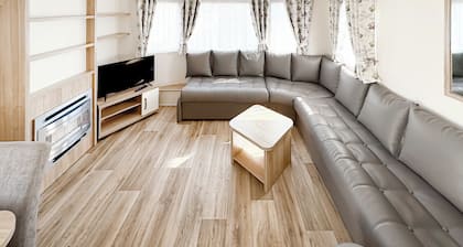 Modern and contemporary 12ft-wide caravan with one double and one twin.