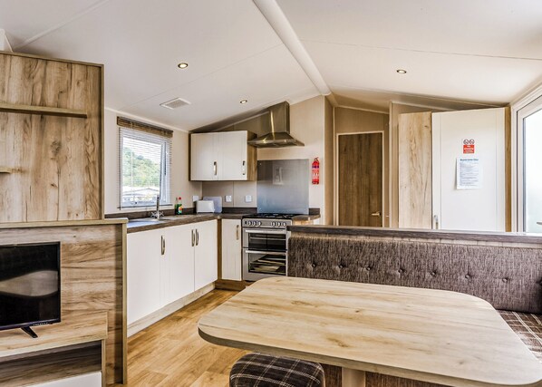 Oven - Modern and contemporary 12ft-wide caravan with one double and one twin. (Bleadon, Weston-Super-Mare)