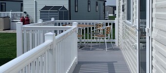 Modern and contemporary 12ft-wide caravan with one double and one twin.