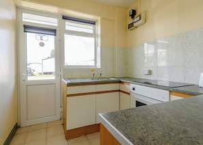 Fridge, oven, stovetop, toaster - Tennyson First Floor Apartment (Roman Bank, Skegness)