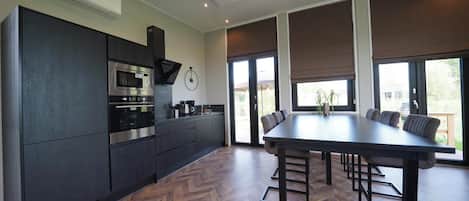 Fridge, stovetop, dishwasher, coffee/tea maker