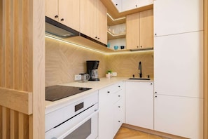 Fridge, microwave, stovetop, coffee/tea maker