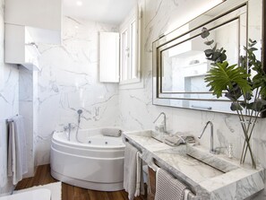 Shower, hair dryer, towels, toilet paper