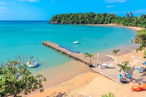 On the beach, sun loungers, beach towels