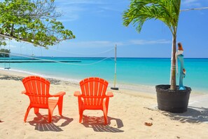 On the beach, sun loungers, beach towels