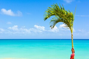 On the beach, sun loungers, beach towels