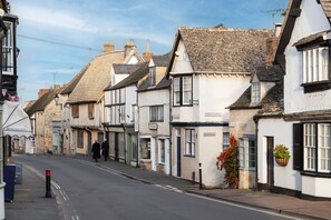 A street lined with traditional buildings, including a shop named 'Bicks Lane'. - Forge Cottage - Winchcombe, Cheltenham, a charming Cotswolds property sleeping 4 guests (Winchcombe)