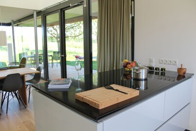 Thatched roof meets modernity, lake view; sauna, garden and much more...