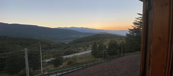 Apartment with panoramic view, fireplace, terrace and garden.