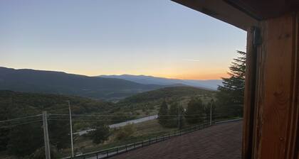 Apartment with panoramic view, fireplace, terrace and garden.