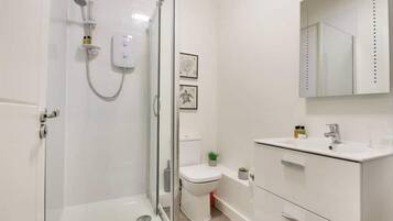 Apartment, 1 Queen Bed | Bathroom | Shower, hair dryer, towels