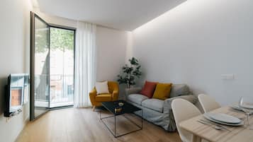 Superior-huoneisto | Oleskelualue | 40–tuumainen äly-TV, jossa satelliittikanavat