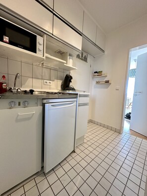 Fridge, microwave, stovetop, coffee/tea maker