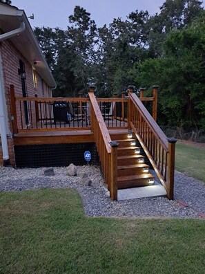 A wooden deck with a staircase leading to a house. - Close to Fort Eisenhower & Augusta Golf Course (Hephzibah)