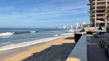 On the beach, sun loungers, beach towels